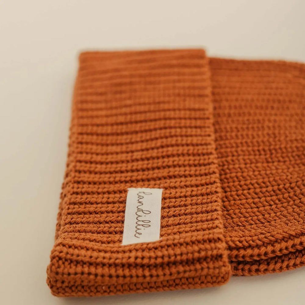 
                  
                    KNIT BEANIE
                  
                