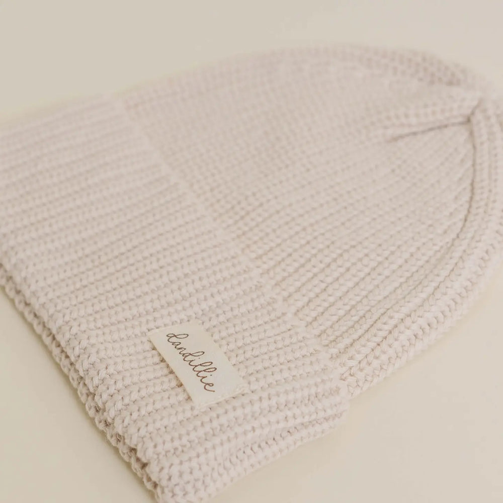 
                  
                    KNIT BEANIE
                  
                